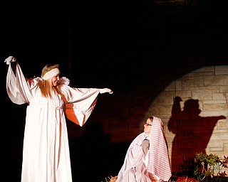 The angel Gabriel, portrayed by Janelle Nagy, visits Mary, portrayed by Rachael Lanham, during the Live Nativity at Zion Lutheran Church in Cornersburg on Sunday evening. EMILY MATTHEWS | THE VINDICATOR