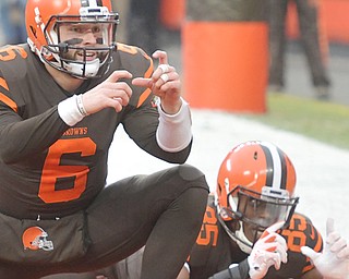 Browns quarterback Baker Mayfield (6) and tight end David Njoku celebrate a touchdown Sunday against the Cincinnati Bengals in Cleveland. The Browns turnaround season is one of the NFL's top stories this year.