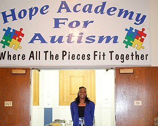 Kimberly Clinkscale, the director of Hope Academy for Autism, poses inside the school, which she founded on Lakeview Avenue on Youngstown’s West Side.