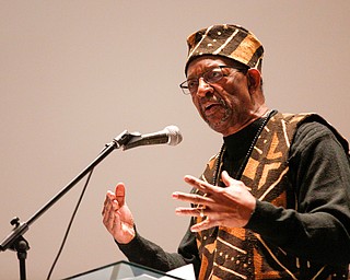Ron Daniels, who held the first Kwanzaa celebration in Youngstown 50 years ago, speaks during a Kwanzaa celebration at New Bethel Baptist Church on Wednesday night. EMILY MATTHEWS | THE VINDICATOR