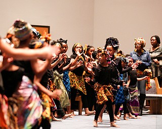 Dancers with the Harambee Youth Organization perform during a Kwanzaa celebration at New Bethel Baptist Church on Wednesday night. EMILY MATTHEWS | THE VINDICATOR
