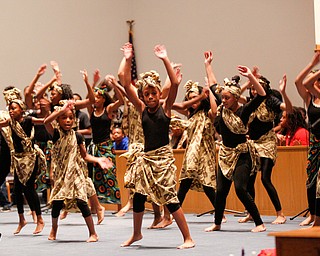 Dancers with the Harambee Youth Organization perform during a Kwanzaa celebration at New Bethel Baptist Church on Wednesday night. EMILY MATTHEWS | THE VINDICATOR