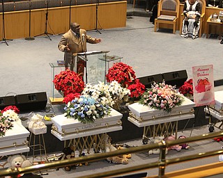      ROBERT  K. YOSAY | THE VINDICATOR.. Services for the five children killed Dec. 9 in a fire at their Parkcliffe Avenue home were held at New Bethel Baptist Church...Rev Louis Macklin  officiated over the first part of the service