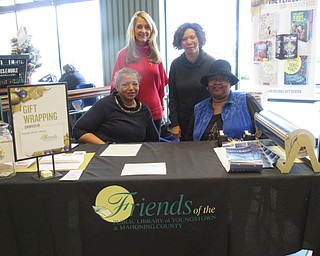 Neighbors | Jessica Harker.Members of the Friends of the Public library East branch from left (front) Wanda Smith, Bobbe Reynolds, (back) Deborah Liptak, the Development Director of the libraries, and Davida Perry-Taylor spent the day at Barnes and Noble in Boardman providing free gift wrapping for donations for the friends.