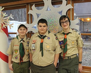 Neighbors | Abby Slanker.Boy Scouts, from left, Malachi Clark, Gianni Derrico and Bryant Garris volunteered at the Boy Scout Camp Stambaugh of the Great Trail Council Boy Scouts of America Breakfast with Santa on Dec. 15.