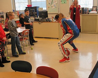 Neighbors | Jessica Harker.Hoops Green performed tricks for Karen DiVito and her second grade students Dec. 14 at Poland Union Middle School.