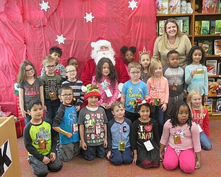 Neighbors | Jessica Harker.Students in Chrissy Pezzulo's kindergarten class posed with Santa on Dec. 19 at Austintown Elementary School.
