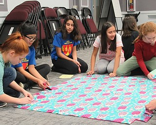 Neighbors | Jessica Harker .Fifth-grade students worked with their sixth-grade WEB leaders to tie blankets on Dec. 18 at Boardman Center Middle School.