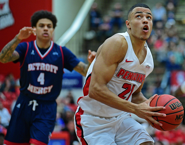 YOUNGSTOWN, OHIO - DECEMBER 28, 2018: Youngstown State's Noe Anabir goes to the basket after getting behind Detroit Mercy's Jacob Holland during the first half of their game, Saturday afternoon at Beeghly Center. Detroit Mercy won 78-66. DAVID DERMER | THE VINDICATOR