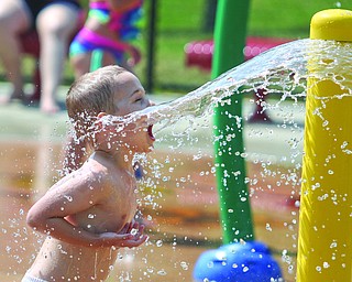  ROBERT K.YOSAY  | THE VINDICATOR..The Julia Kurinka Children's Play Area... as Leo Dudash of Poland 3.5 years old - walks into the spray of water from the Splash Pad at Mill Creek Park..(ok from grandparent )4 in Austintown plays under the water at the Splash Pad Park  - open 10-7  from Memorial Day to Labor day..-30-