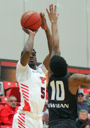 William D. Lewis The Vindicator  YSU's Kendale HAmpton(5) shoots over  Oakland's Karmari Newman(10) during 12302018 action at YSU.