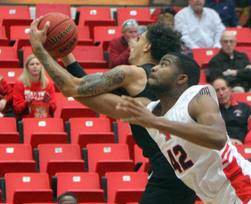 William D. Lewis The Vindicator  YSU's Alex Holcombe(42)andOakland's Kenny Pittman(24) during 12-302018 action at YSU.