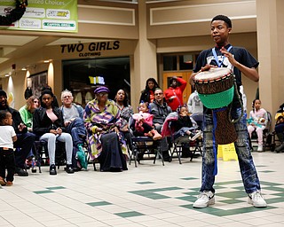 Aric Smith, 14, of Youngstown, drums with Harambee inside 20 Federal Place during First Night Youngstown Monday night. EMILY MATTHEWS | THE VINDICATOR