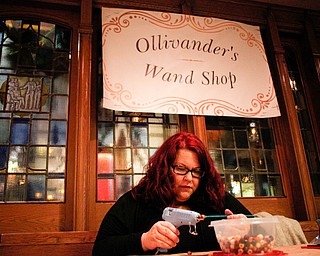 Abbe Studer, of Massillon, Ohio, makes wands at the Harry Potter Experience inside Trinity United Methodist Church during First Night Youngstown Monday night. EMILY MATTHEWS | THE VINDICATOR