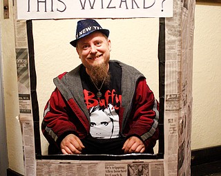 Nathan Singley, of Austintown, poses for a photo at the Harry Potter Experience inside Trinity United Methodist Church during First Night Youngstown Monday night. EMILY MATTHEWS | THE VINDICATOR