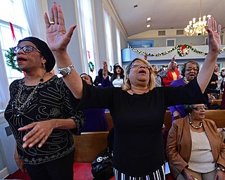 YOUNGSTOWN, OHIO - JANUARY 1, 2019: Carol Griffin from Youngstown, left, and Linda Jenkins from Youngstown, right, sing, Tuesday morning during the Community Emancipation Proclamation & Installation of Officers Service at Calvary Baptist Church. DAVID DERMER | THE VINDICATOR