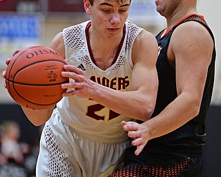 CANFIELD, OHIO - JANUARY 2, 2019: South Range's Nick Matos drives on Springfield's Shane Eynon during the second half of their game, Wednesday night at South Range High School. DAVID DERMER | THE VINDICATOR