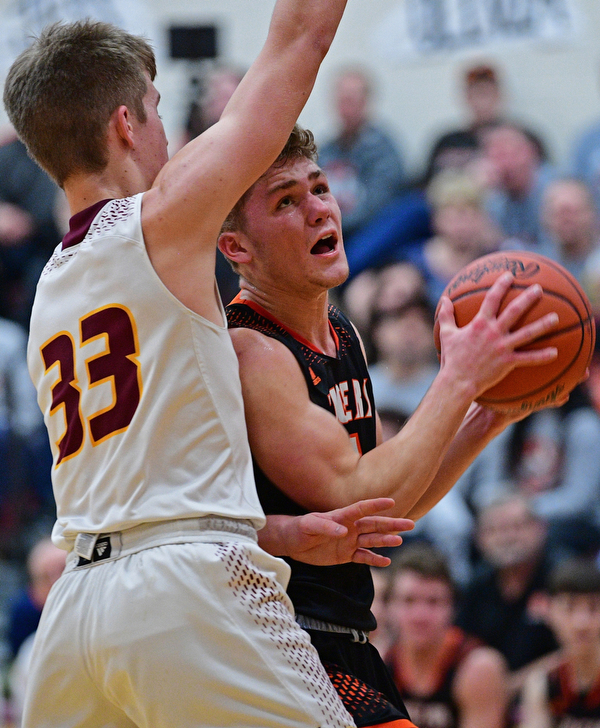 CANFIELD, OHIO - JANUARY 2, 2019: Springfield's Evan Ohlin goes to the basket against South Range's Ben Irons during the second half of their game, Wednesday night at South Range High School. DAVID DERMER | THE VINDICATOR
