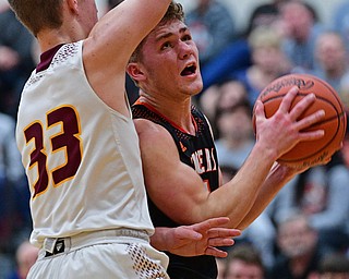 CANFIELD, OHIO - JANUARY 2, 2019: Springfield's Evan Ohlin goes to the basket against South Range's Ben Irons during the second half of their game, Wednesday night at South Range High School. DAVID DERMER | THE VINDICATOR