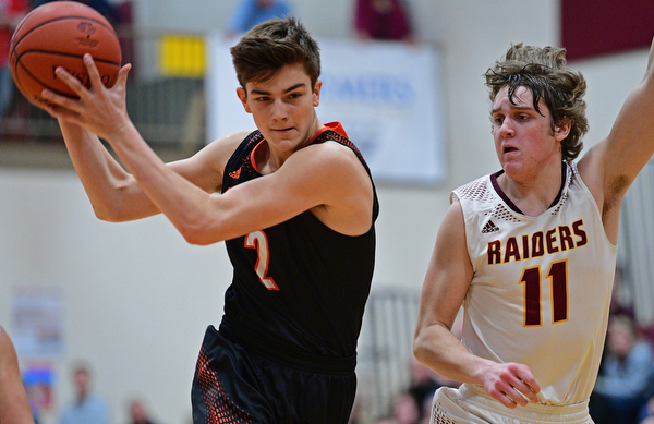 CANFIELD, OHIO - JANUARY 2, 2019: Springfield's Drew Clark drives on South Range's Dante DiGaetano during the second half of their game, Wednesday night at South Range High School. DAVID DERMER | THE VINDICATOR