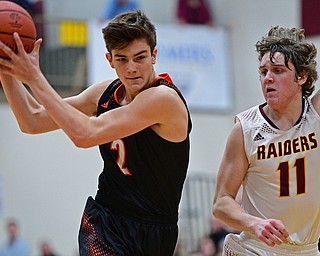 CANFIELD, OHIO - JANUARY 2, 2019: Springfield's Drew Clark drives on South Range's Dante DiGaetano during the second half of their game, Wednesday night at South Range High School. DAVID DERMER | THE VINDICATOR