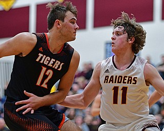 CANFIELD, OHIO - JANUARY 2, 2019: Springfield's Shane Eynon goes to the basket against South Range's Dante DiGaetano during the second half of their game, Wednesday night at South Range High School. DAVID DERMER | THE VINDICATOR