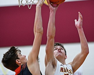 CANFIELD, OHIO - JANUARY 2, 2019: South Range's Nick Matos puts up a shot over Springfield's Drew Clark during the second half of their game, Wednesday night at South Range High School. DAVID DERMER | THE VINDICATOR