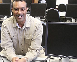 Robert Mitchell, job placement specialist, sits in the Job Center at the Goodwill Industries facility in Liberty. The organization recently opened a Job Connection and Resource Center, which offers 12 desktop computers for searching employments ads, applying for jobs online and other uses.