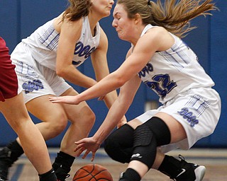 Poland's Brooke Bobbey, left, and Morgan Kluchar go after the ball during their game against Mooney at Poland on Thursday night. EMILY MATTHEWS | THE VINDICATOR