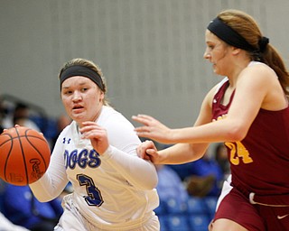 Poland's Mia Gajdos dribbles the ball while Mooney's Alaina Scavina tries to block her during their game at Poland on Thursday night. EMILY MATTHEWS | THE VINDICATOR