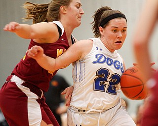 Poland's Kat Partika dribbles the ball while Mooney's Caitlyn Perry tries to block her during their game at Poland on Thursday night. EMILY MATTHEWS | THE VINDICATOR