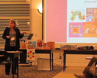 Neighbors | Jessica Harker.Pam Brock, Early Literacy Specialist at the library, spoke to parents Dec. 12 about how to improve their childs early literacy skills at the Imagine With Us program.