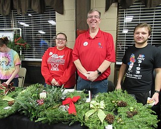 Neighbors | Jessica Harker.Elise and Andy Yantes, along with Dylan Gorgi, sold wreaths to benefit the Austintown Robotics Team on Dec. 14 at Austintown Park's Winter Market.