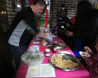 Neighbors | Jessica Harker.A free create your own S'mores table was available to community members at the Winter Market at Austintown Park.