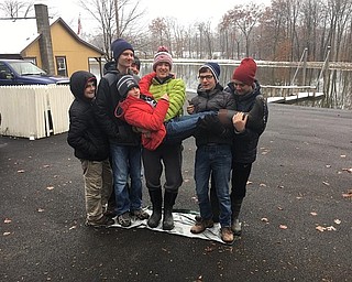 Neighbors | Submitted.Members of Boy Scout Troop 25 participate in a team building challenge called “Magic Carpet” were the Scouts stand on a tarp and completely turn it over without stepping or falling off of it.  Pictured are, from left, Josh Farley, Wesley Rich, Steven Deak, Jacob Kuszaj, Chris Altiere (being carried), Evan McNally and Owen Bowser.