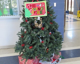 Neighbors | Jessica Harker.Students at Poland Middle School donated winter outdoor wear to the school's Giving Tree throughout the month of December.