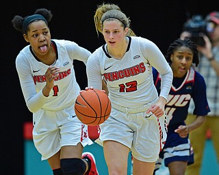 YOUNGSTOWN, OHIO - JANUARY 3, 2018: Youngstown State's Chelsea Olson dribbles away from Illinois-Chicago's Jasmine Gaines after forcing a turnover during the second half of their game, Thursday night Beeghley Center. Youngstown State won 81-29. DAVID DERMER | THE VINDICATOR