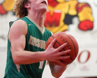 Ursuline's Vince Armini looks towards the hoop during their game against Cardinal Mooney on Friday night. EMILY MATTHEWS | THE VINDICATOR