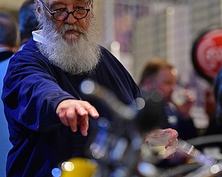 WARREN, OHIO - JANUARY 4, 2018: Richard Mankamyer, of Bath, Ohio, shows off a motorcycle he drove in the past during the preview party for 19th annual vintage motorcycle exhibit at the National Packard Museum. DAVID DERMER | THE VINDICATOR