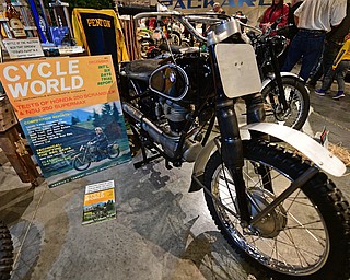 WARREN, OHIO - JANUARY 4, 2018: A motorcycle that was driven by Jack Penton, featured on the magazine cover to the left, on display during the preview party for 19th annual vintage motorcycle exhibit at the National Packard Museum. DAVID DERMER | THE VINDICATOR