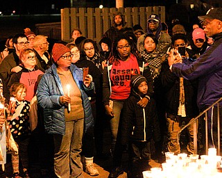 People gather for a vigil for Matthew Burroughs outside of Burroughs' Royal Mall Apartment on Saturday night. EMILY MATTHEWS | THE VINDICATOR