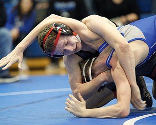 Salem's Tony Seddon, left, and Jackson Milton's Austin Stanke wrestle during the Jackson-Milton Invitational finals on Saturday. EMILY MATTHEWS | THE VINDICATOR