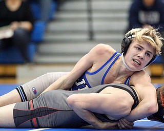 Jackson Milton's Austin Stanke tries to pin down Salem's Tony Seddon during the Jackson-Milton Invitational finals on Saturday. EMILY MATTHEWS | THE VINDICATOR