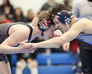 Salem's Caiden Hart, left, and Rootsown's Caleb Edwards wrestle during the Jackson-Milton Invitational finals on Saturday. EMILY MATTHEWS | THE VINDICATOR