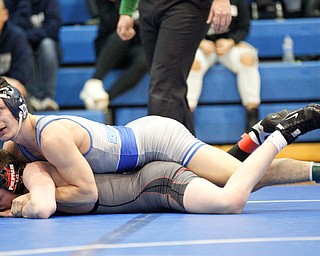 Rootsown's Caleb Edwards tries to pin down Salem's Caiden Hart during the Jackson-Milton Invitational finals on Saturday. EMILY MATTHEWS | THE VINDICATOR