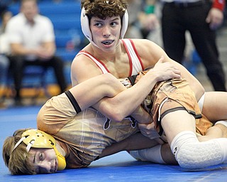 South Range's Michael Markulin, top, and Pymatuning Valley's Jake Edelman wrestle during the Jackson-Milton Invitational finals on Saturday. EMILY MATTHEWS | THE VINDICATOR