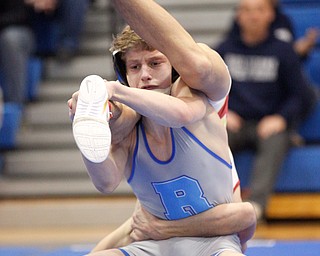 Rootsown's Mason Kline wrestles South Range's Kyle Keenan during the Jackson-Milton Invitational finals on Saturday. EMILY MATTHEWS | THE VINDICATOR