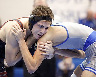 Girard's Alex Delgarbino, left, and Rootsown's Trent Duvall wrestle during the Jackson-Milton Invitational finals on Saturday. EMILY MATTHEWS | THE VINDICATOR