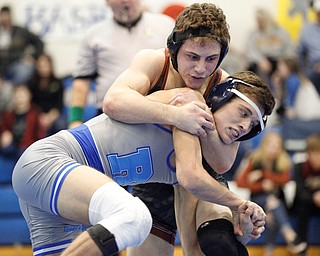 Girard's Alex Delgarbino and Rootsown's Trent Duvall wrestle during the Jackson-Milton Invitational finals on Saturday. EMILY MATTHEWS | THE VINDICATOR