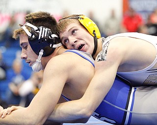 Crestview's Isaac Ricketts tries to pin down Jackson Milton's Anthony Pizzuto during the Jackson-Milton Invitational finals on Saturday. EMILY MATTHEWS | THE VINDICATOR